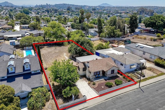 4693 71st St, La Mesa, CA 91942 - aerial perspective of suburban area featuring property boundaries highlighted and a mountain backdrop