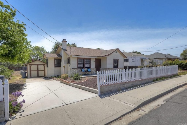 4693 71st St, La Mesa, CA 91942 - single story home featuring a storage unit, a fenced front yard, driveway, a chimney, and a shingled roof