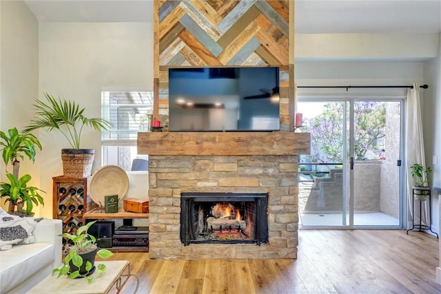 25072 Leucadia St Unit E, Laguna Niguel, CA 92677 - living room featuring wood finished floors and a fireplace