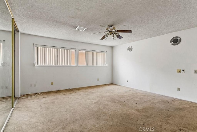 3431 Caspian Ave, Long Beach, CA 90810 - unfurnished room featuring a ceiling fan, carpet, and a textured ceiling