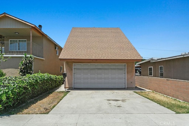 3431 Caspian Ave, Long Beach, CA 90810 - view of front of property featuring stucco siding, a shingled roof, and a detached garage