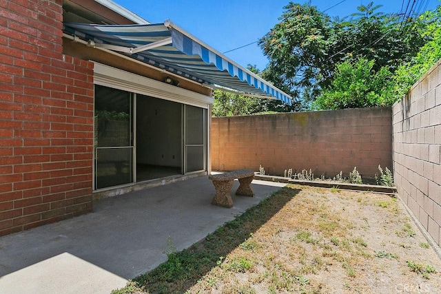 3431 Caspian Ave, Long Beach, CA 90810 - fenced backyard with a patio area