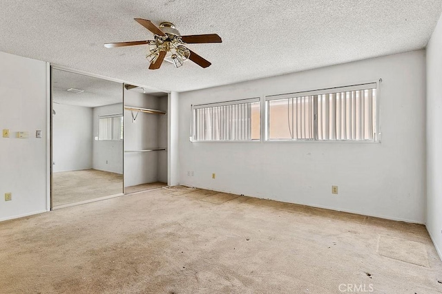 3431 Caspian Ave, Long Beach, CA 90810 - unfurnished bedroom with carpet flooring, a closet, a textured ceiling, and a ceiling fan