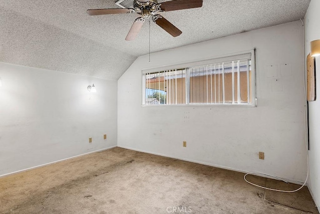3431 Caspian Ave, Long Beach, CA 90810 - spare room featuring a textured ceiling, ceiling fan, vaulted ceiling, and carpet
