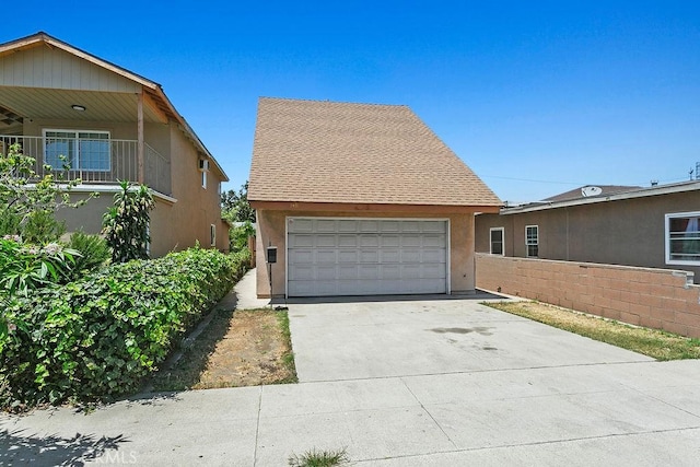 3431 Caspian Ave, Long Beach, CA 90810 - view of property exterior featuring concrete driveway, stucco siding, and an attached garage