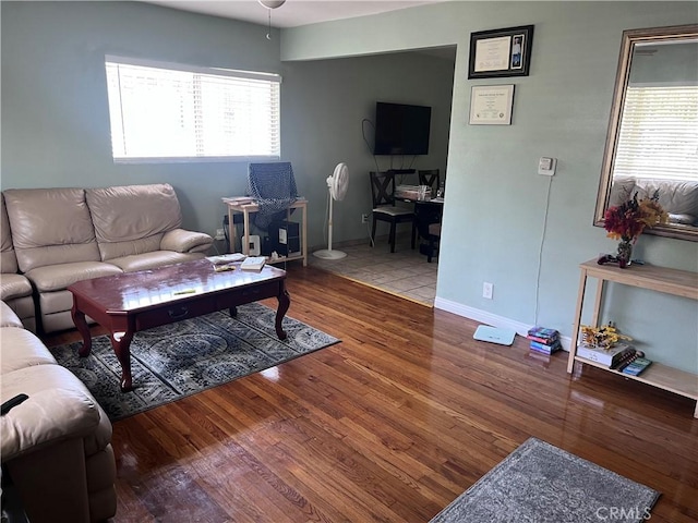1222 E 103rd St, Los Angeles, CA 90002 - living area featuring a desk, plenty of natural light, and wood finished floors