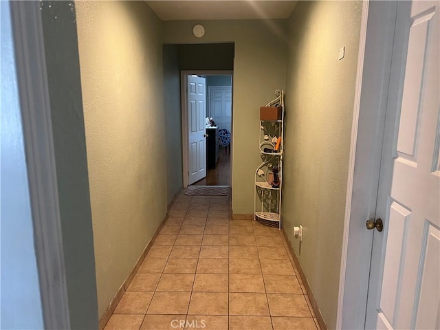 1222 E 103rd St, Los Angeles, CA 90002 - hall with light tile patterned floors and a textured wall