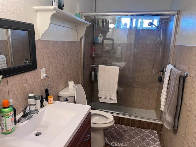 1222 E 103rd St, Los Angeles, CA 90002 - full bathroom featuring tile walls, vanity, and a stall shower