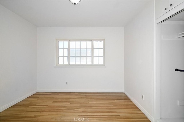 19324 Victory Blvd, Reseda, CA 91335 - unfurnished bedroom featuring light wood-type flooring and a closet