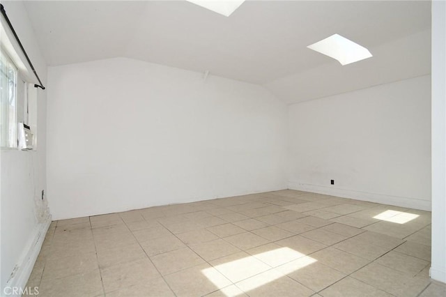 19324 Victory Blvd, Reseda, CA 91335 - bonus room featuring a skylight, vaulted ceiling, and light tile patterned floors