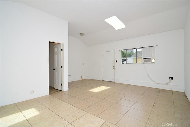 19324 Victory Blvd, Reseda, CA 91335 - spare room featuring vaulted ceiling, light tile patterned flooring, and cooling unit