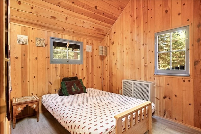 31701 Christmas Tree Ln, Running Springs, CA 92382 - bedroom with vaulted ceiling, wood finished floors, and wooden walls