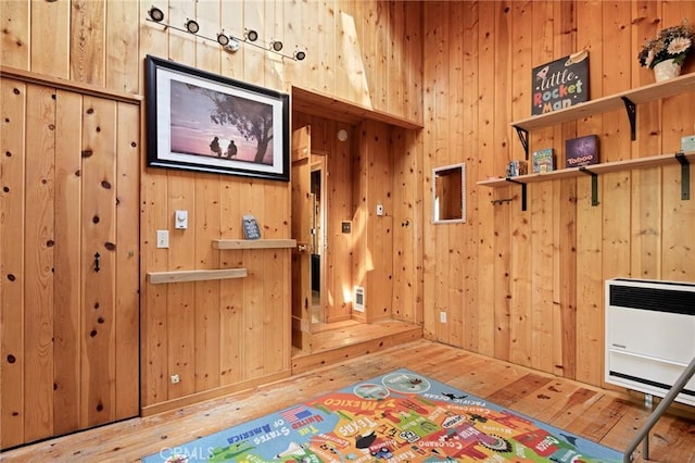 31701 Christmas Tree Ln, Running Springs, CA 92382 - playroom with hardwood / wood-style floors, heating unit, and wooden walls