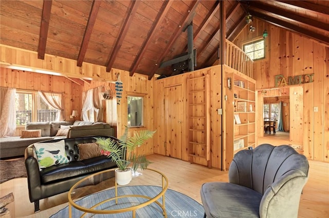 31701 Christmas Tree Ln, Running Springs, CA 92382 - living room featuring wooden walls, wood finished floors, healthy amount of natural light, a wood ceiling with exposed beams, and high vaulted ceiling