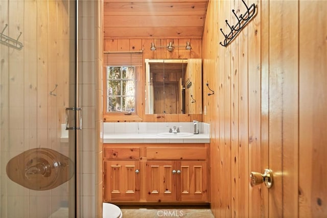 31701 Christmas Tree Ln, Running Springs, CA 92382 - full bathroom with wood walls, vanity, and a shower stall