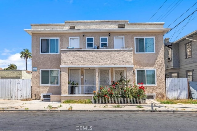 3315 W 17th St, Los Angeles, CA 90019 - view of property with stucco siding and covered porch