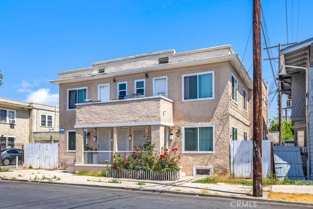 3315 W 17th St, Los Angeles, CA 90019 - view of property with covered porch and stucco siding