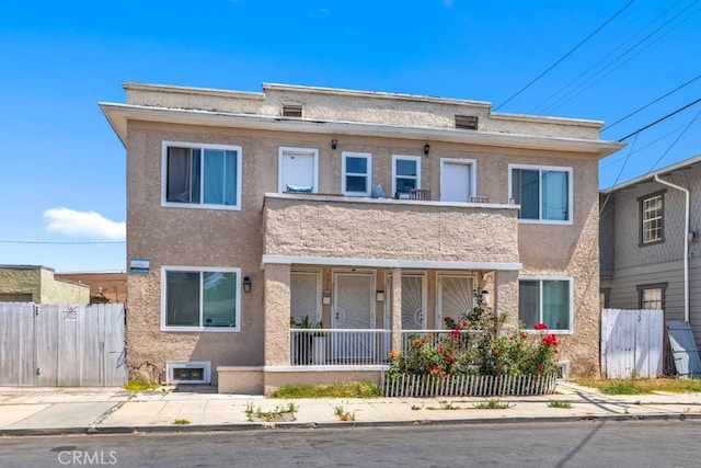 3315 W 17th St, Los Angeles, CA 90019 - townhome / multi-family property featuring stucco siding and covered porch