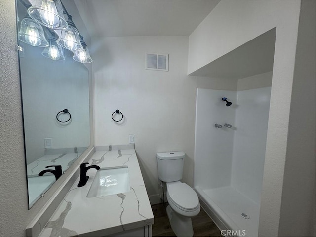 10615 Wolfe Ave, Riverside, CA 92505 - full bath featuring a shower, vanity, and wood finished floors