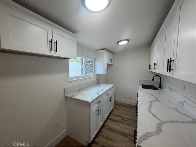 10615 Wolfe Ave, Riverside, CA 92505 - kitchen featuring light stone counters, dark wood finished floors, white cabinetry, and vaulted ceiling