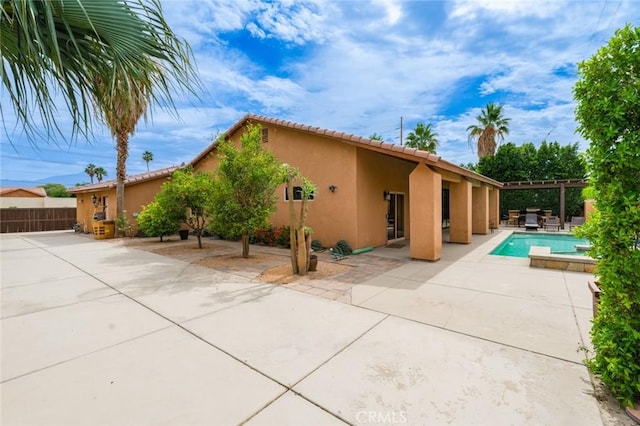 79140 Fred Waring Dr, Bermuda Dunes, CA 92203 - back of house with stucco siding, a patio, and a tiled roof