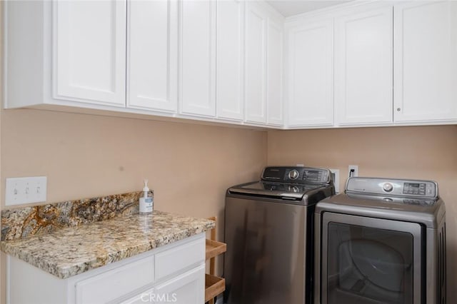 79140 Fred Waring Dr, Bermuda Dunes, CA 92203 - washroom with washing machine and clothes dryer and cabinet space