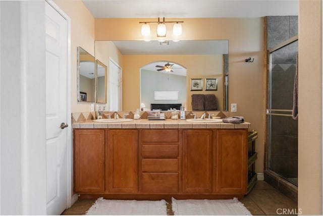 79140 Fred Waring Dr, Bermuda Dunes, CA 92203 - full bathroom featuring a ceiling fan, double vanity, a shower stall, and tile patterned floors