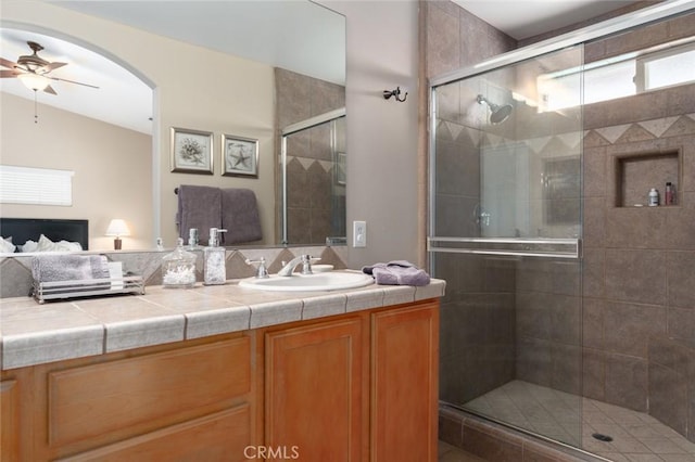 79140 Fred Waring Dr, Bermuda Dunes, CA 92203 - bathroom featuring ceiling fan, vanity, and a stall shower