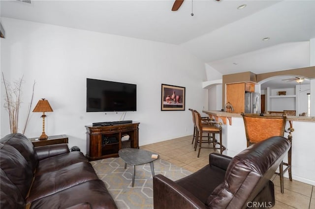 79140 Fred Waring Dr, Bermuda Dunes, CA 92203 - living room featuring ceiling fan, light tile patterned floors, arched walkways, and lofted ceiling