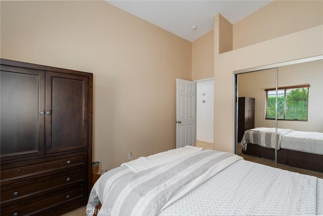 79140 Fred Waring Dr, Bermuda Dunes, CA 92203 - bedroom featuring light colored carpet, a closet, and high vaulted ceiling