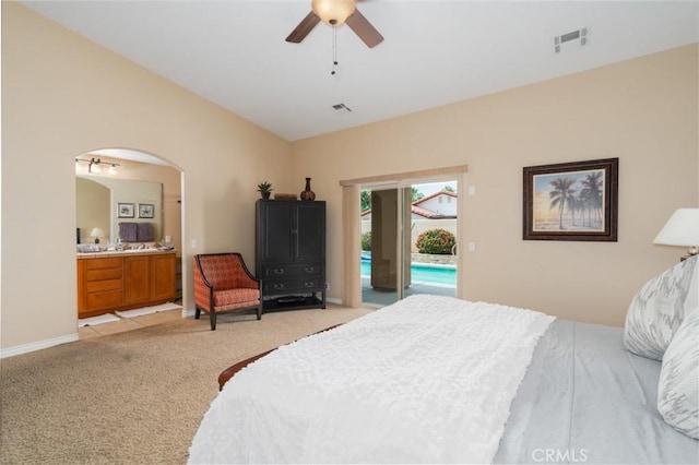 79140 Fred Waring Dr, Bermuda Dunes, CA 92203 - bedroom with access to outside, light colored carpet, arched walkways, ensuite bathroom, and ceiling fan