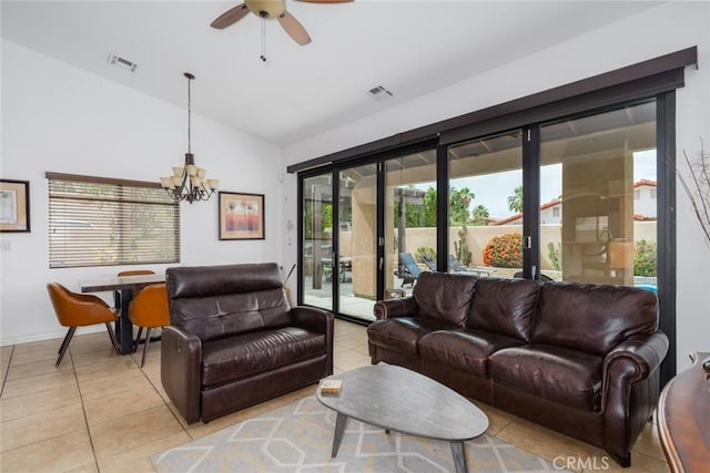 79140 Fred Waring Dr, Bermuda Dunes, CA 92203 - living area with light tile patterned flooring, vaulted ceiling, a chandelier, and a ceiling fan