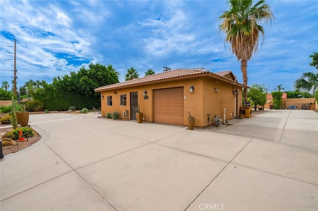 79140 Fred Waring Dr, Bermuda Dunes, CA 92203 - view of side of property featuring stucco siding and a tile roof