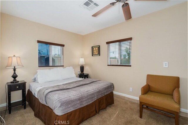 79140 Fred Waring Dr, Bermuda Dunes, CA 92203 - bedroom with multiple windows, light carpet, and ceiling fan