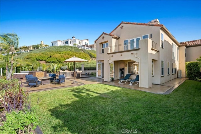 8 Pavona, Newport Coast, CA 92657 - rear view of property featuring a balcony, a patio, an outdoor living space, and stucco siding