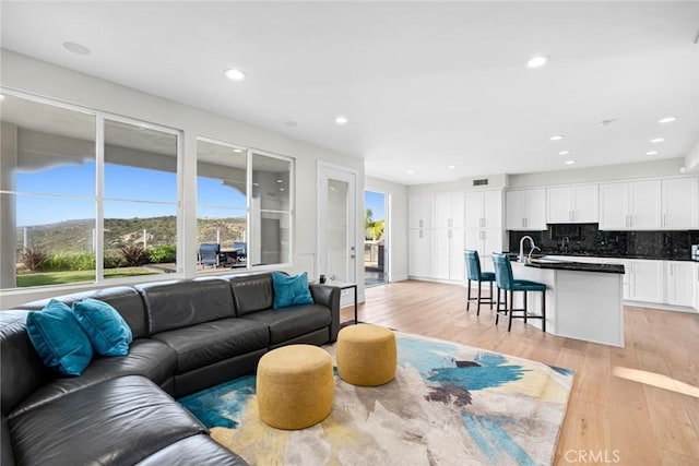 8 Pavona, Newport Coast, CA 92657 - living area featuring light wood-type flooring and recessed lighting