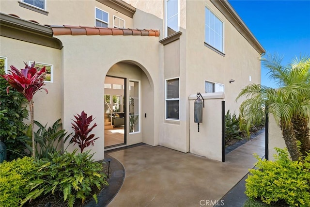 8 Pavona, Newport Coast, CA 92657 - property entrance featuring stucco siding and a patio area