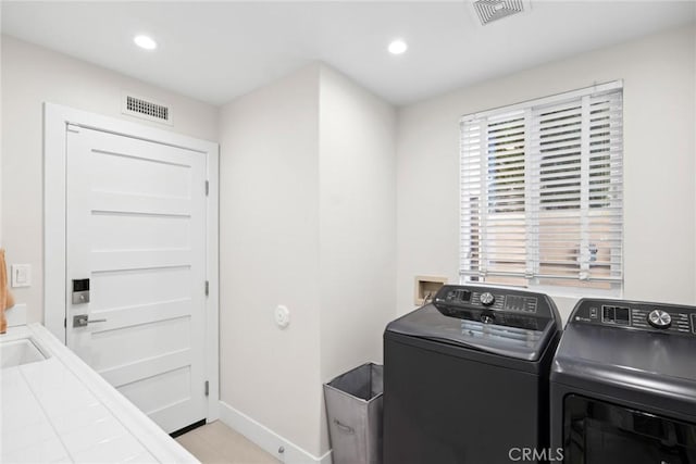 8 Pavona, Newport Coast, CA 92657 - washroom featuring washer and dryer and recessed lighting