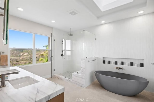 8 Pavona, Newport Coast, CA 92657 - full bath with a stall shower, a freestanding tub, recessed lighting, double vanity, and tile patterned flooring