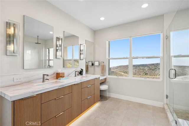 8 Pavona, Newport Coast, CA 92657 - bathroom featuring a shower stall, double vanity, and recessed lighting
