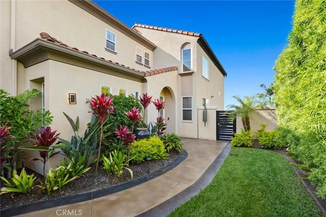 8 Pavona, Newport Coast, CA 92657 - view of front facade featuring stucco siding and a tiled roof