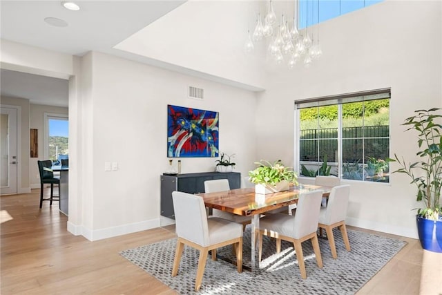 8 Pavona, Newport Coast, CA 92657 - dining area with a chandelier and light wood finished floors