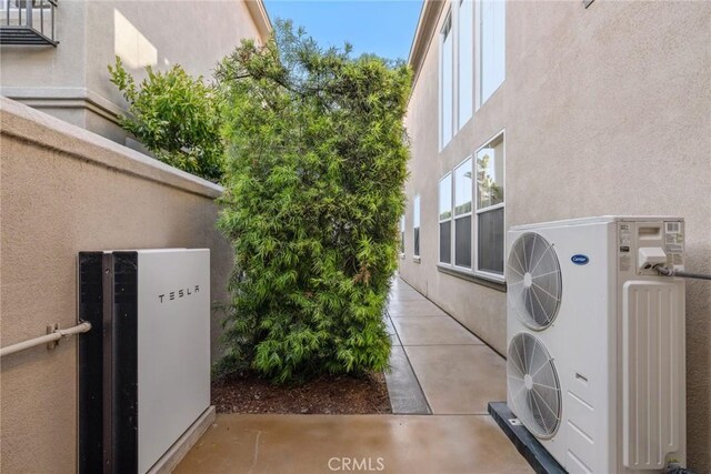 8 Pavona, Newport Coast, CA 92657 - view of property exterior featuring stucco siding and an ac unit