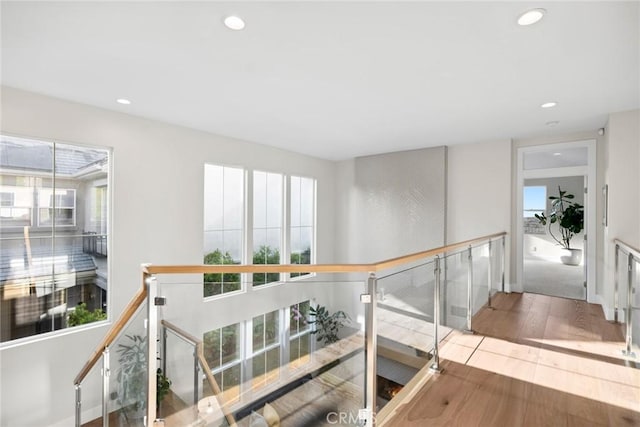 8 Pavona, Newport Coast, CA 92657 - hallway with healthy amount of natural light, wood finished floors, recessed lighting, and an upstairs landing