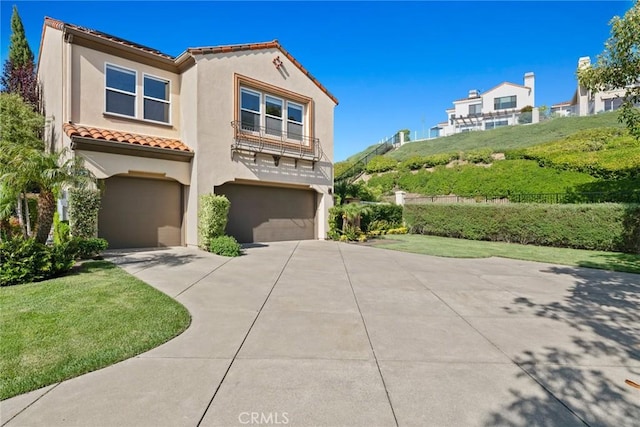 8 Pavona, Newport Coast, CA 92657 - view of front of property with driveway, an attached garage, stucco siding, and a tile roof