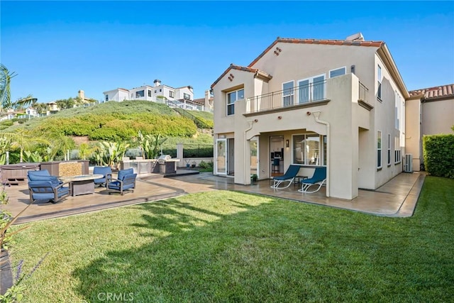 8 Pavona, Newport Coast, CA 92657 - back of house featuring a balcony, a patio, stucco siding, a yard, and an outdoor living space