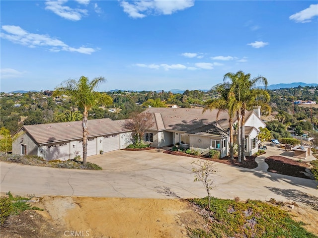 2240 Aqua Hill Rd, Fallbrook, CA 92028 - view of front of home featuring concrete driveway, an attached garage, stucco siding, and a tile roof