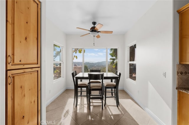 2240 Aqua Hill Rd, Fallbrook, CA 92028 - dining space featuring ceiling fan, light tile patterned flooring, and a mountain view
