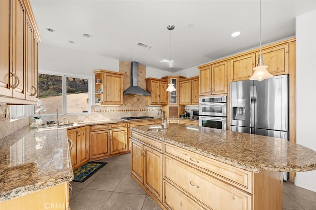 2240 Aqua Hill Rd, Fallbrook, CA 92028 - kitchen with wall chimney exhaust hood, appliances with stainless steel finishes, decorative backsplash, light stone countertops, and decorative light fixtures