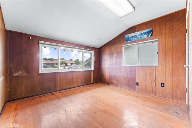 1305 S Westchester Dr, Anaheim, CA 92804 - spare room with hardwood / wood-style floors, vaulted ceiling, and wood walls